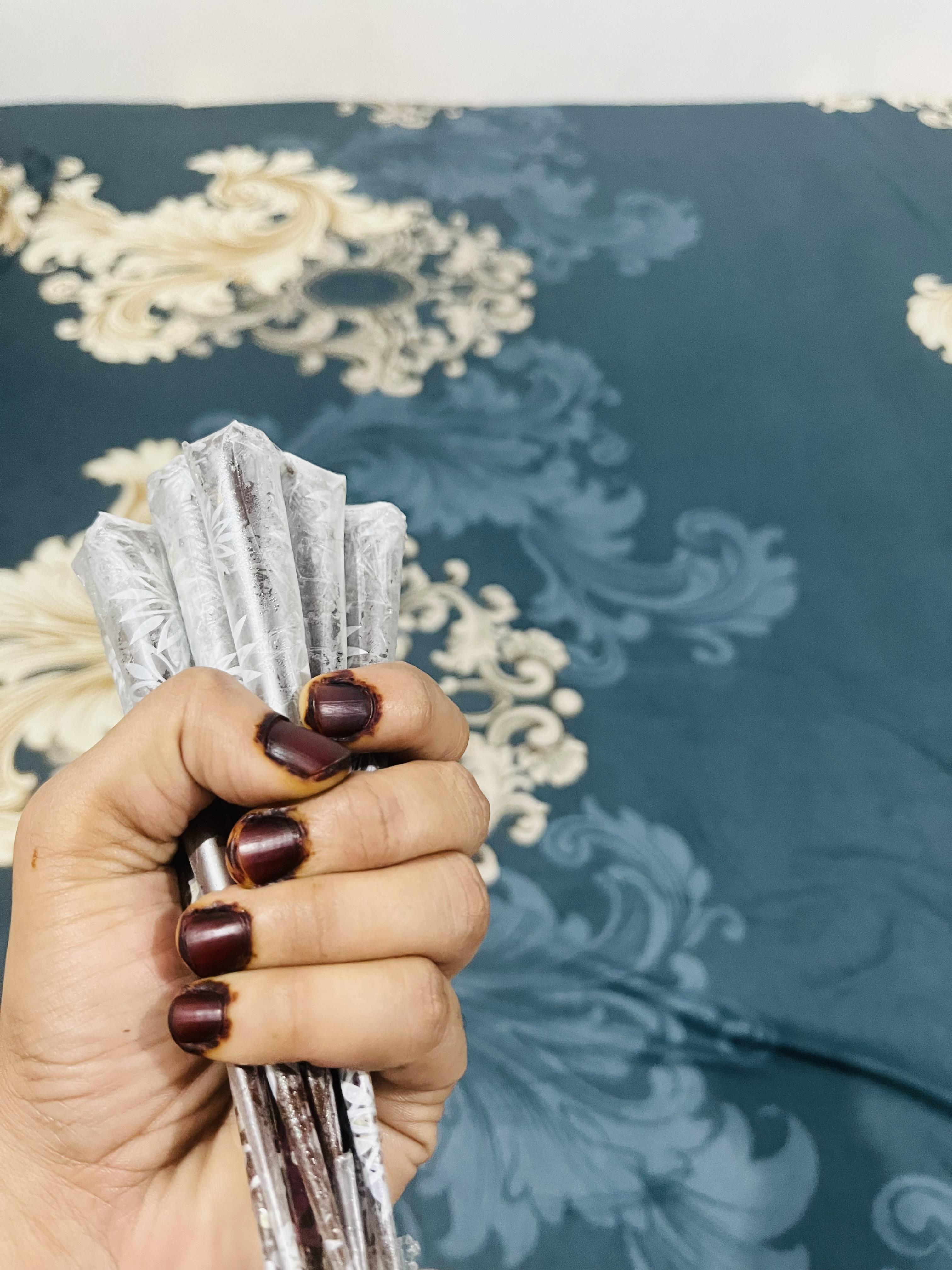Permanent maroon nail henna